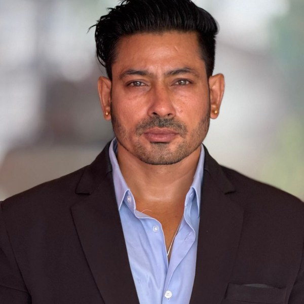 Sample portrait of a man in a suit, saved with a 50 KB limit
